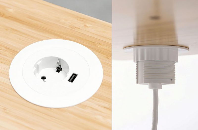 Ovanifrån- och underifrånvy av en genomföring i ett bambuskivbord med ett enda eluttag och USB-anslutning.